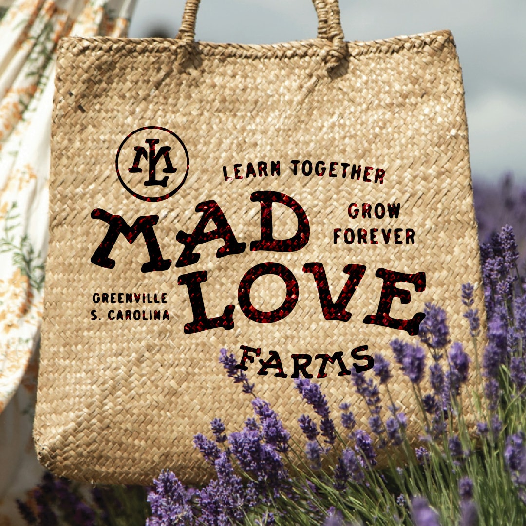 Mad Love Farms — a jute tote printed with the Mad Love Farms wordmark, carried through a lavender field