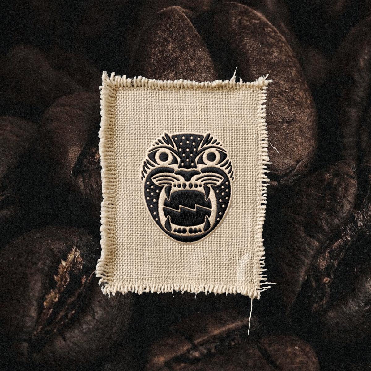 Alma Oscura — jaguar face patch on coffee beans