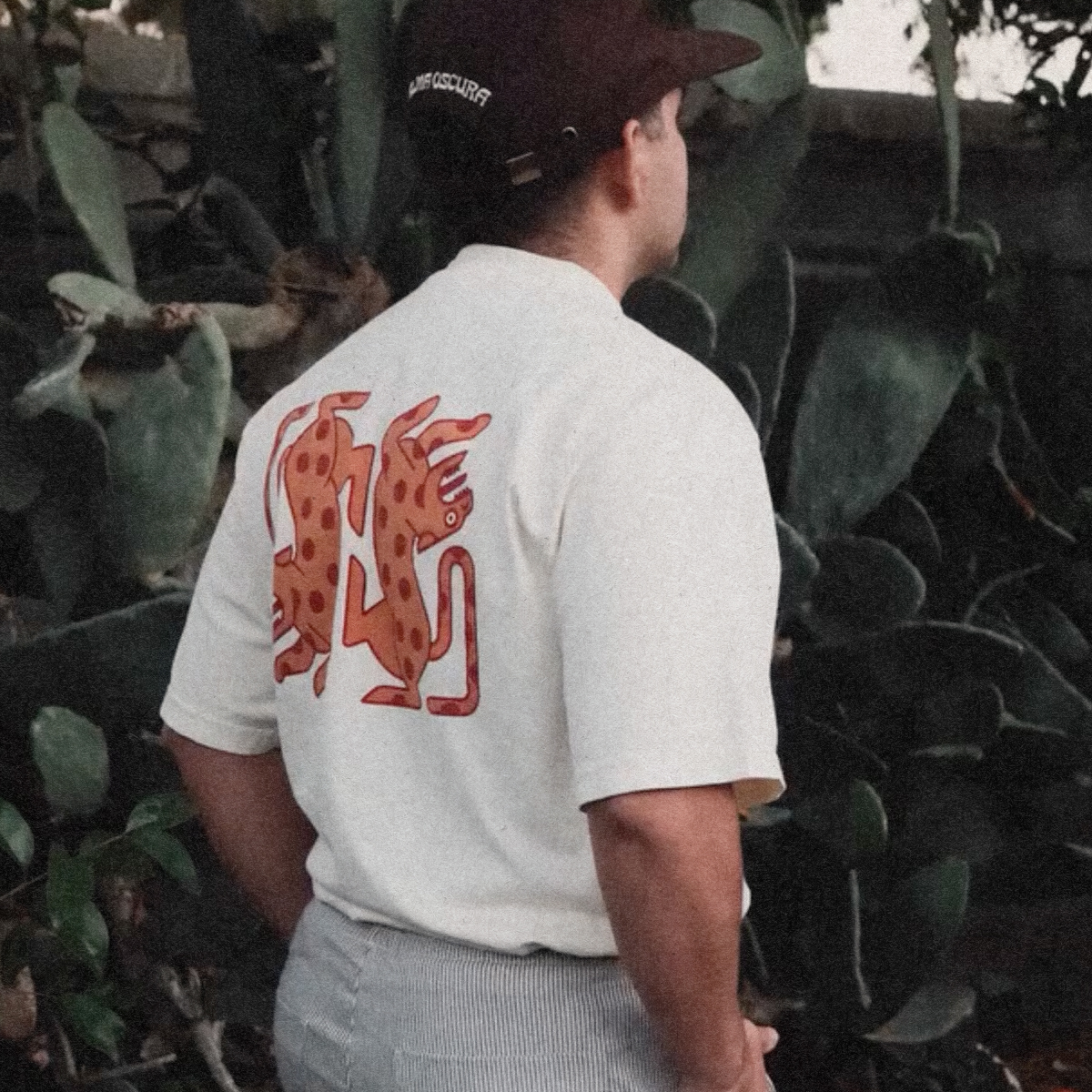 Alma Oscura — branded apparel, jaguar graphic tee worn outdoors